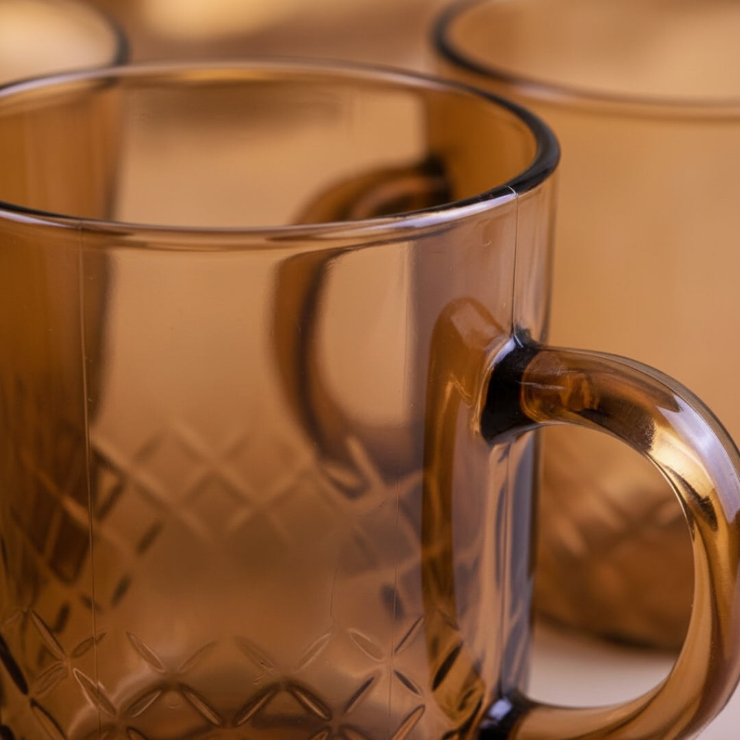 Close-up of a glass mug with a textured surface